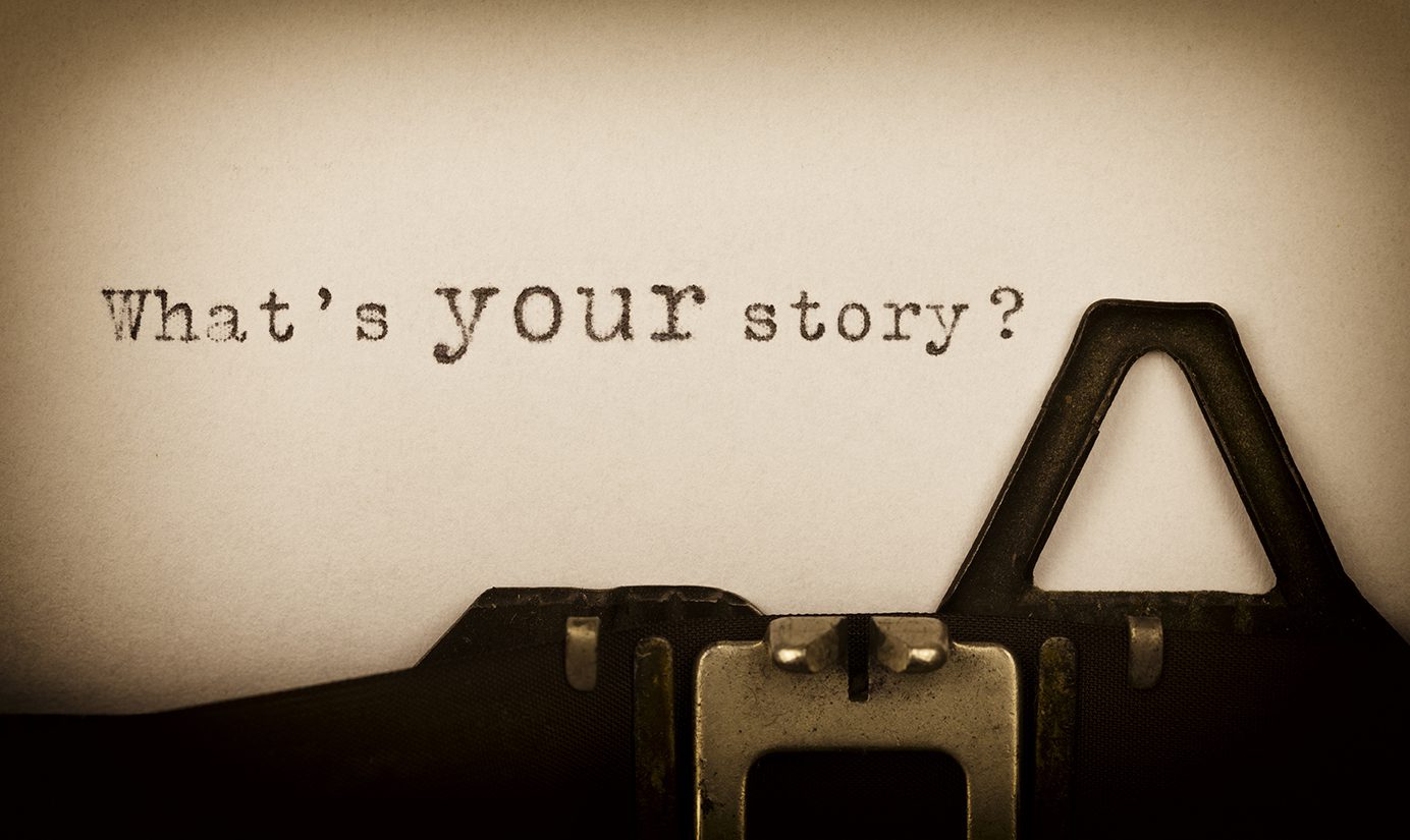 Typewriter closeup of paper saying What's your story?